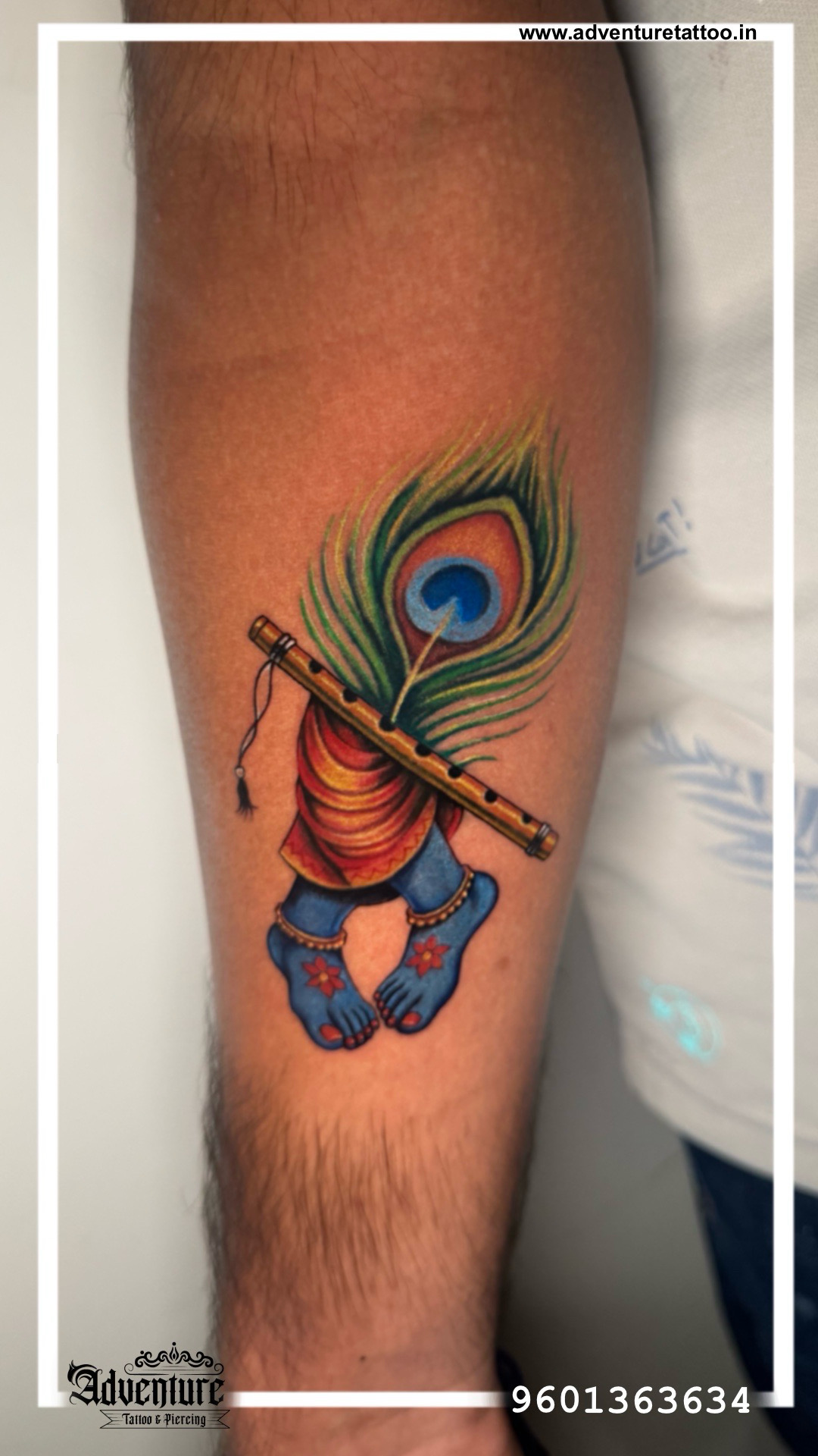 Lord Krishna Tattoo Design Ahmedabad | Peacock Feather & Flute Tattoo | Adventure TattooKrishna Tattoo Ahmedabad mein karwana chahte ho? Adventure Tattoo Studio mein dekho ye stunning Krishna Charan design โ peacock feather, bansuri aur sacred feet ka perfect combination.Lord Krishna Tattoo Design Ahmedabad | Peacock Feather & Flute Tattoo | Adventure Tattoo