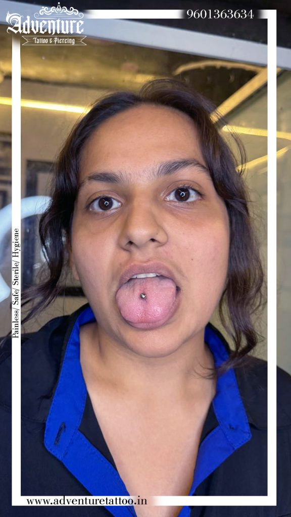 Professional tongue piercing at Adventure Tattoo & Piercing Studio Ahmedabad using sterile equipment.
